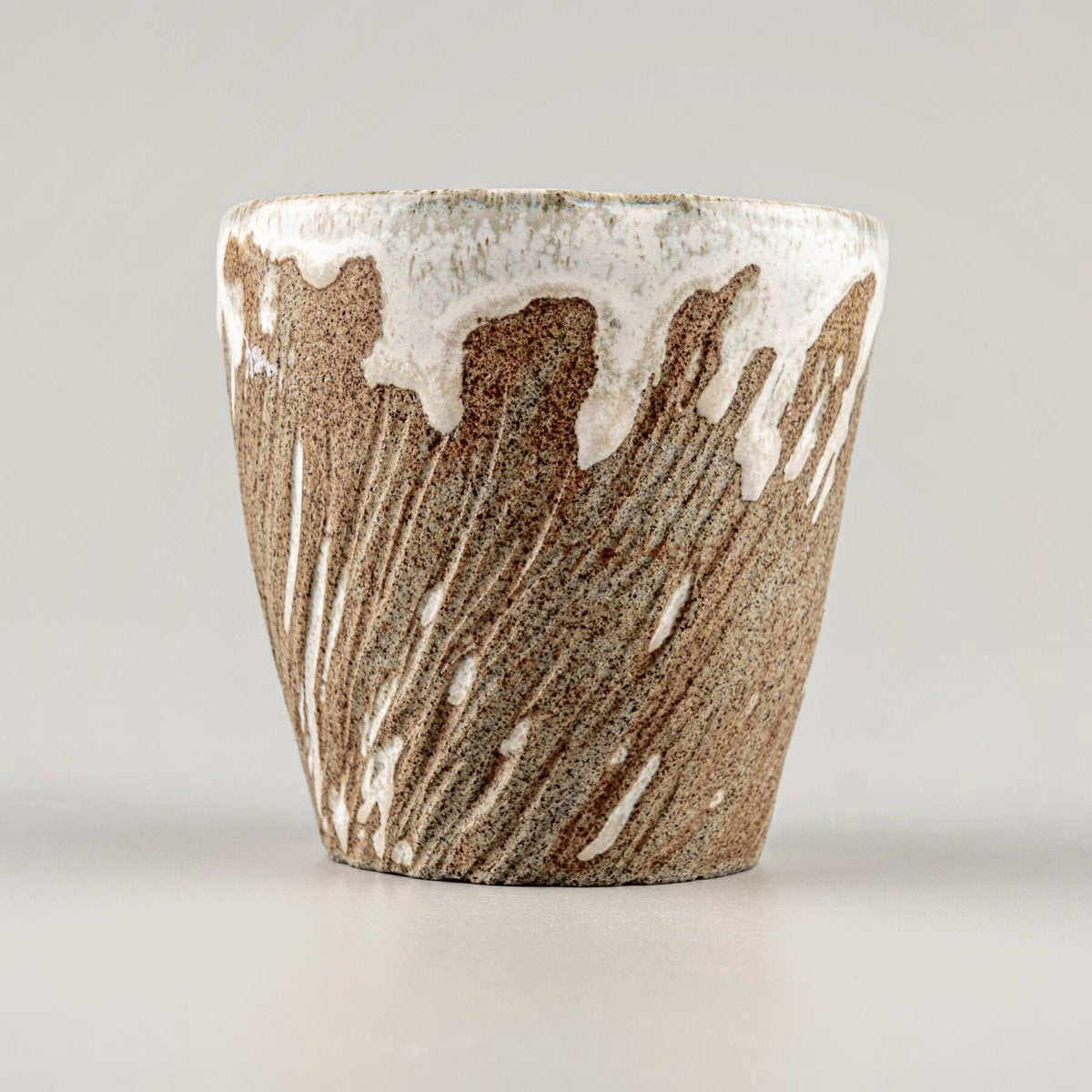 Handmade ceramic espresso mugs with rustic stoneware clay and white semi-gloss glaze.