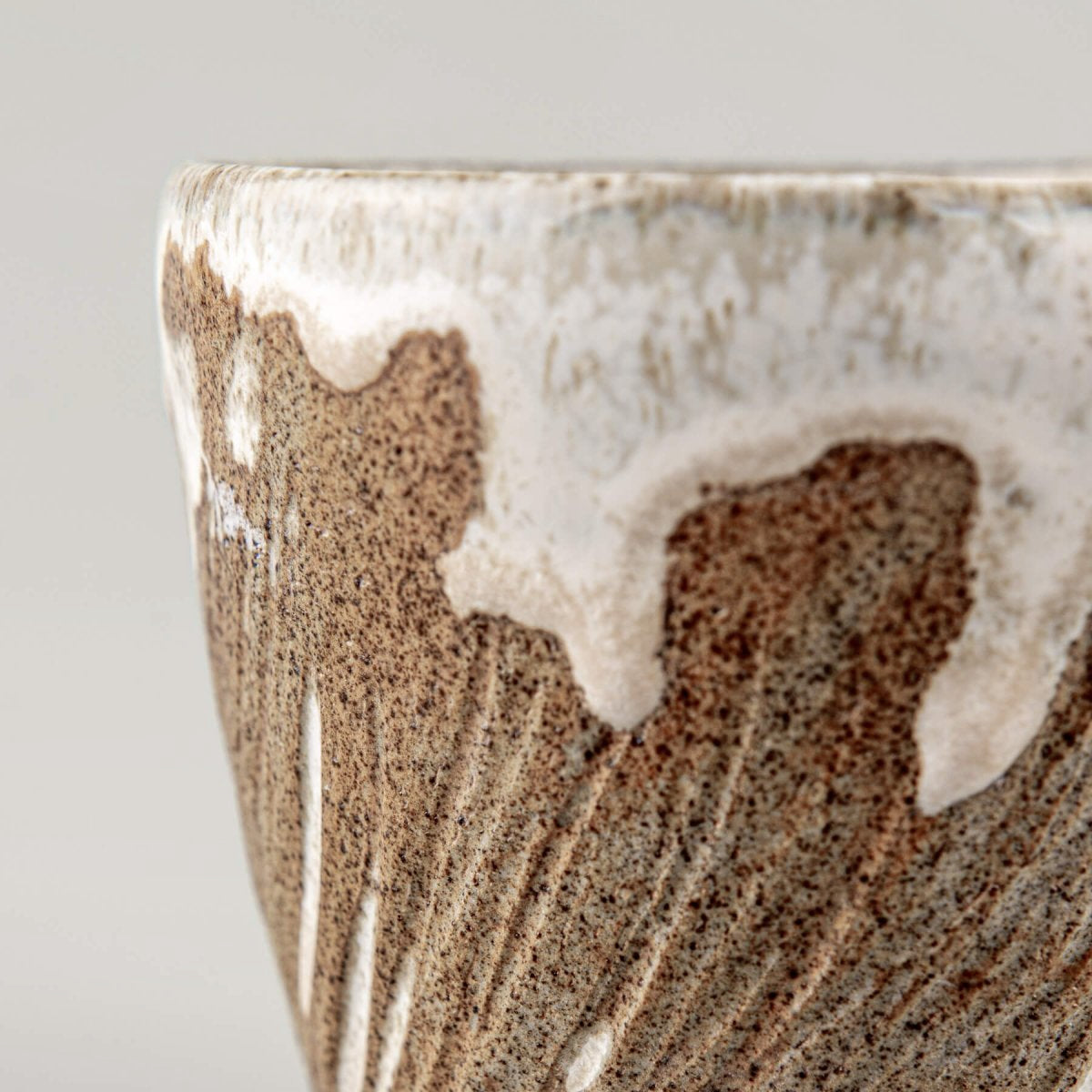Handcrafted ceramic espresso mug with unique white glaze dripping effect.