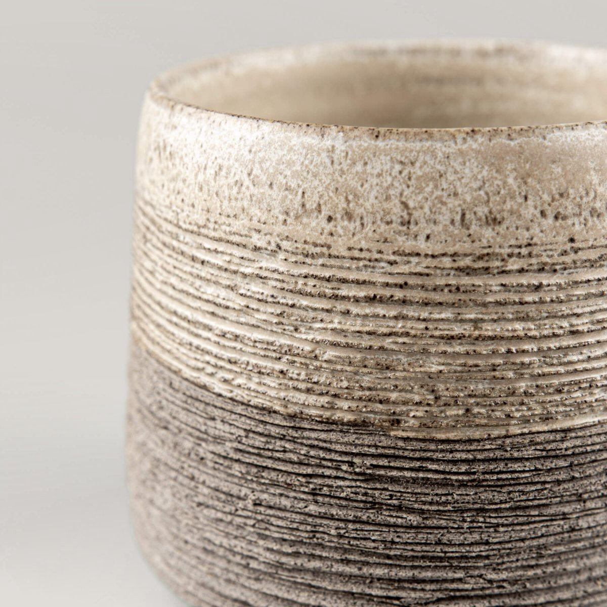 Elegant handmade pottery coffee mugs in neutral tones, perfect for interior design and gift ideas.