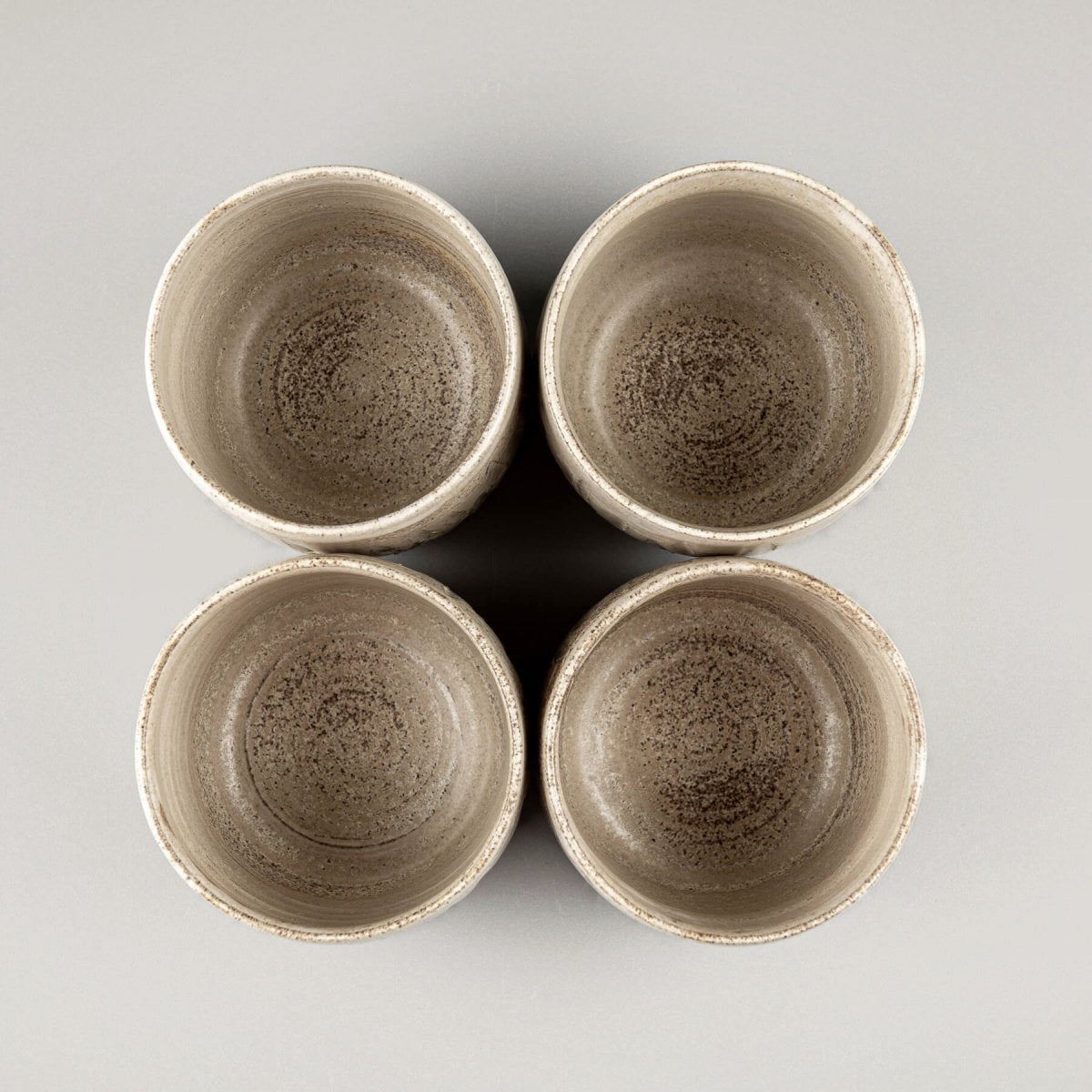 Top view of ceramic handmade cups showcasing interior matte glaze finish.