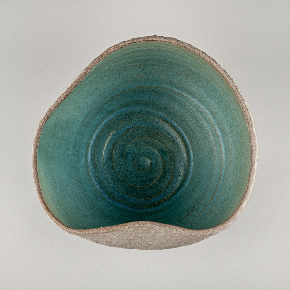 Decorative ceramic vases centerpiece with carved stoneware texture and handmade turquoise glaze.