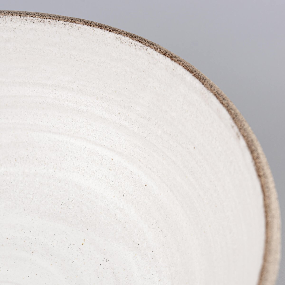 Neutral-toned ceramic bowl for kitchens, restaurants, or boutique hotel tableware, crafted with natural stoneware clay.
