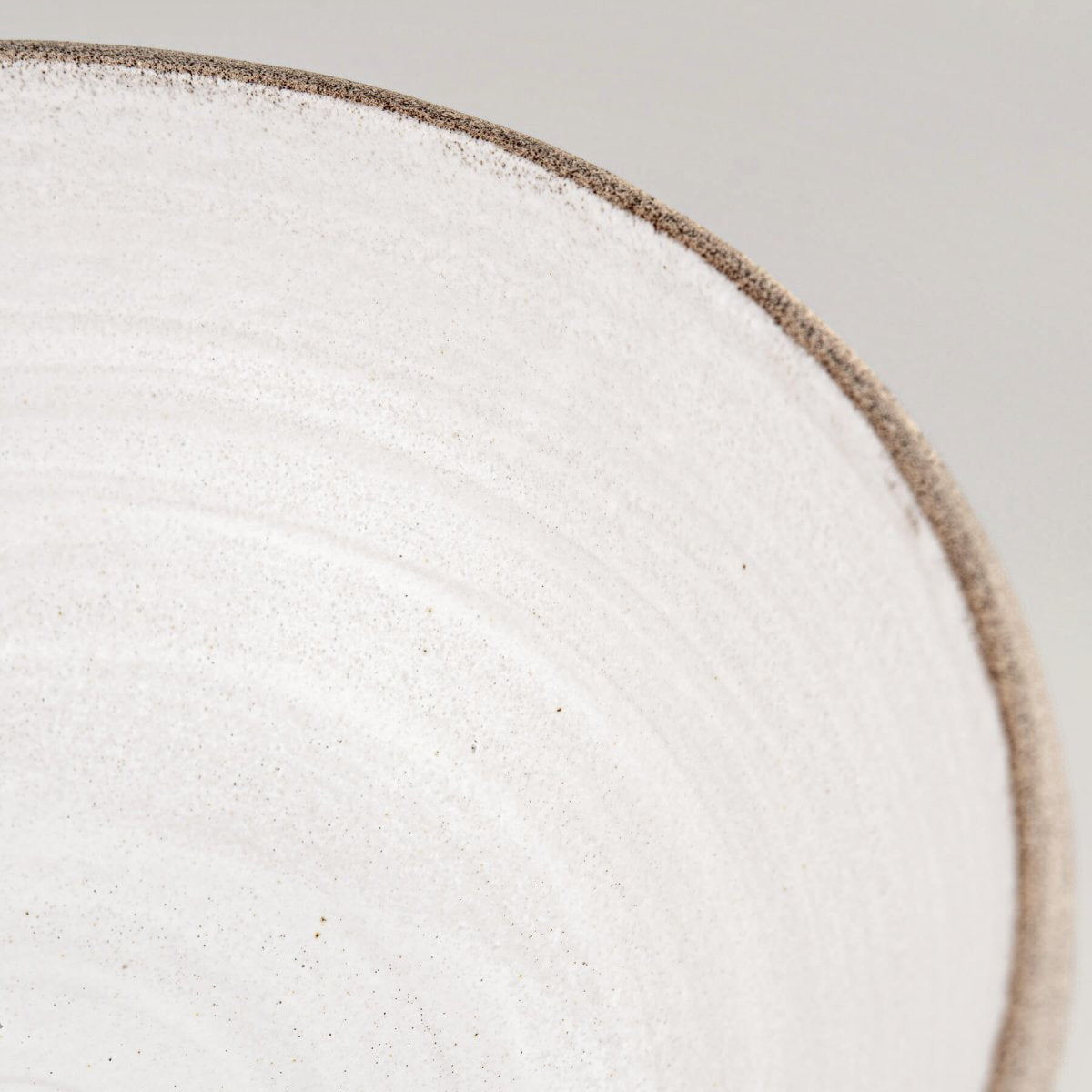 Neutral-toned ceramic bowl for kitchens, restaurants, or boutique hotel tableware, crafted with natural stoneware clay.