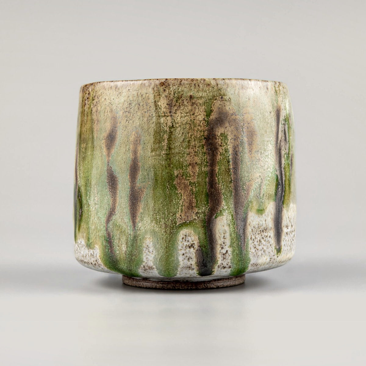 Handmade custom ceramic mugs with rustic stoneware texture and unique glaze finish.