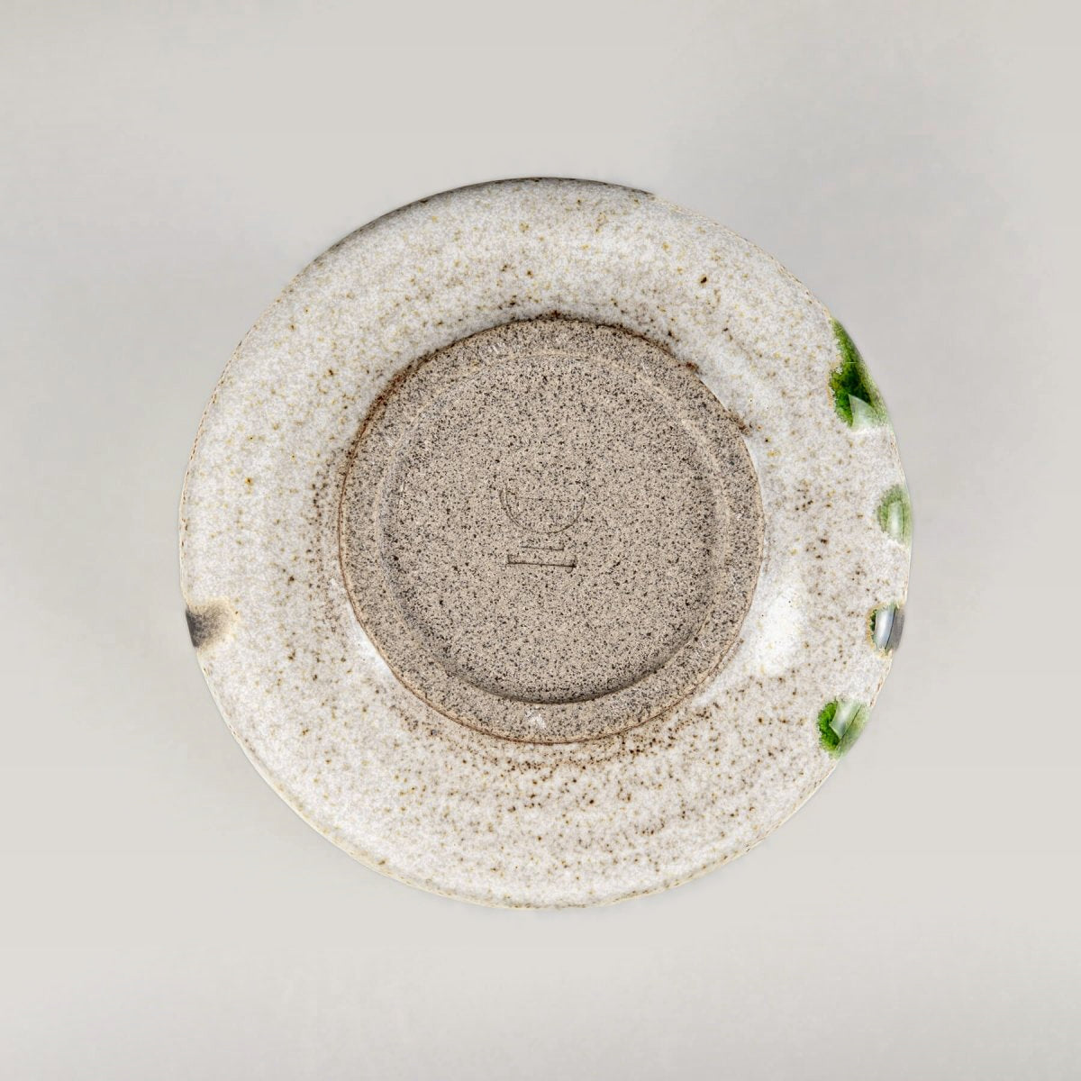 Stoneware kitchenware mug with a natural textured surface and luxury handmade decor.