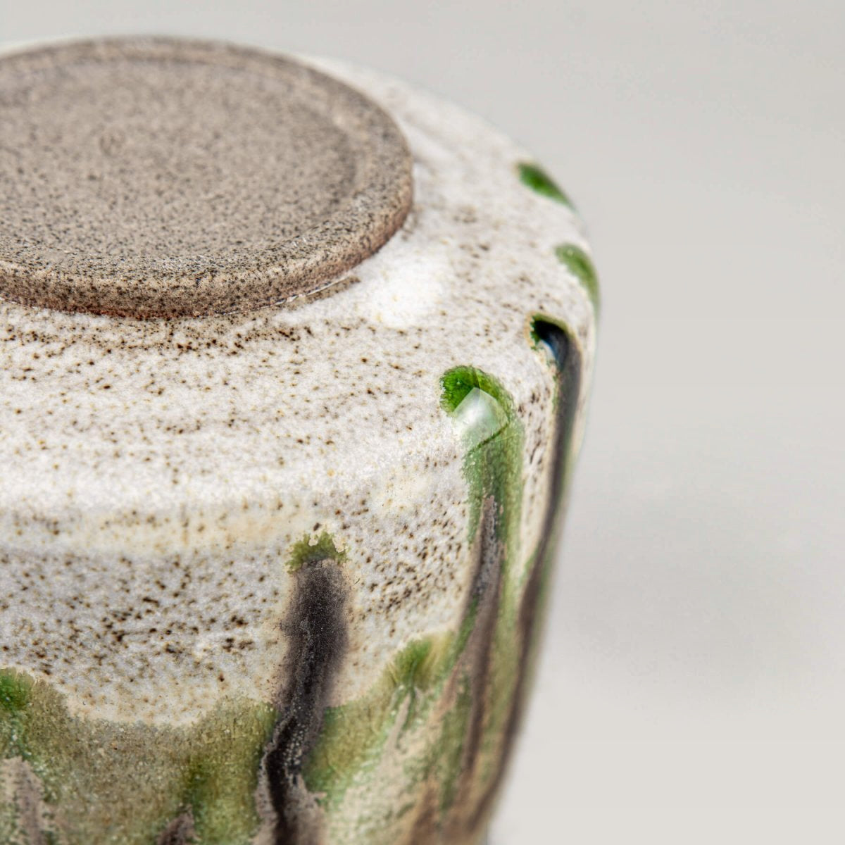 Unique handmade ceramic mug with layered glaze, ideal for design-focused interiors.