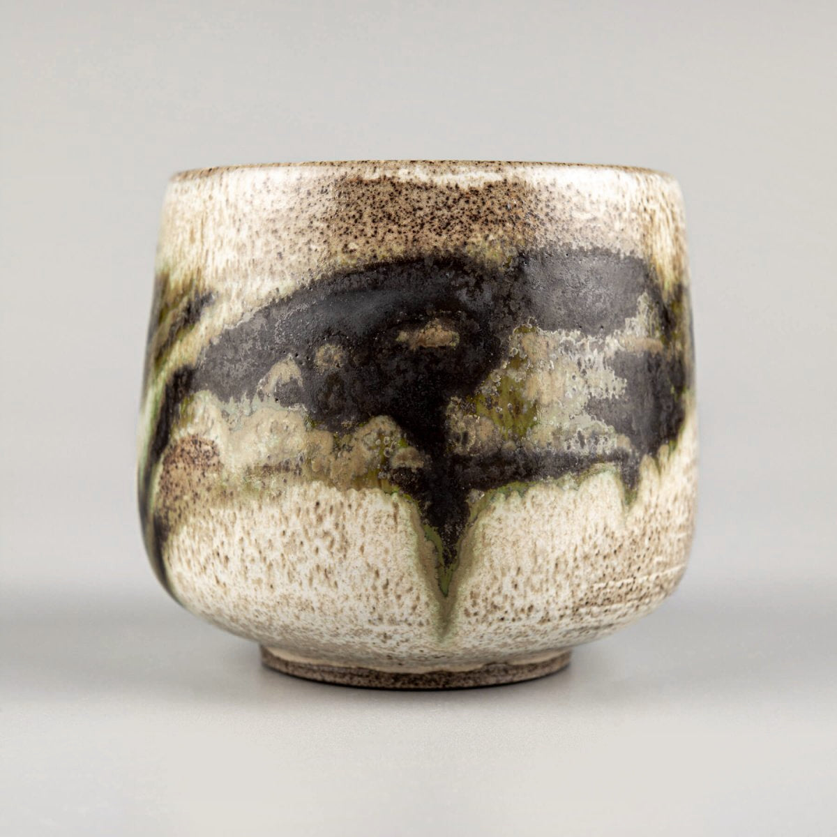 Handmade stoneware mug with unique layered glazes for coffee, tea, and cappuccino.
