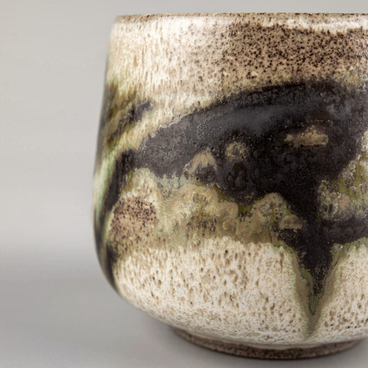 Elegant stoneware mugs with one-of-a-kind glaze effects for culinary presentation.