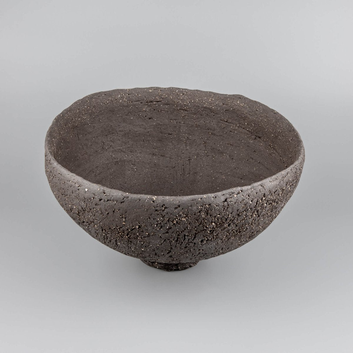 Handcrafted centerpiece side view with deep ceramic form for collectible pottery and fine dining decor.