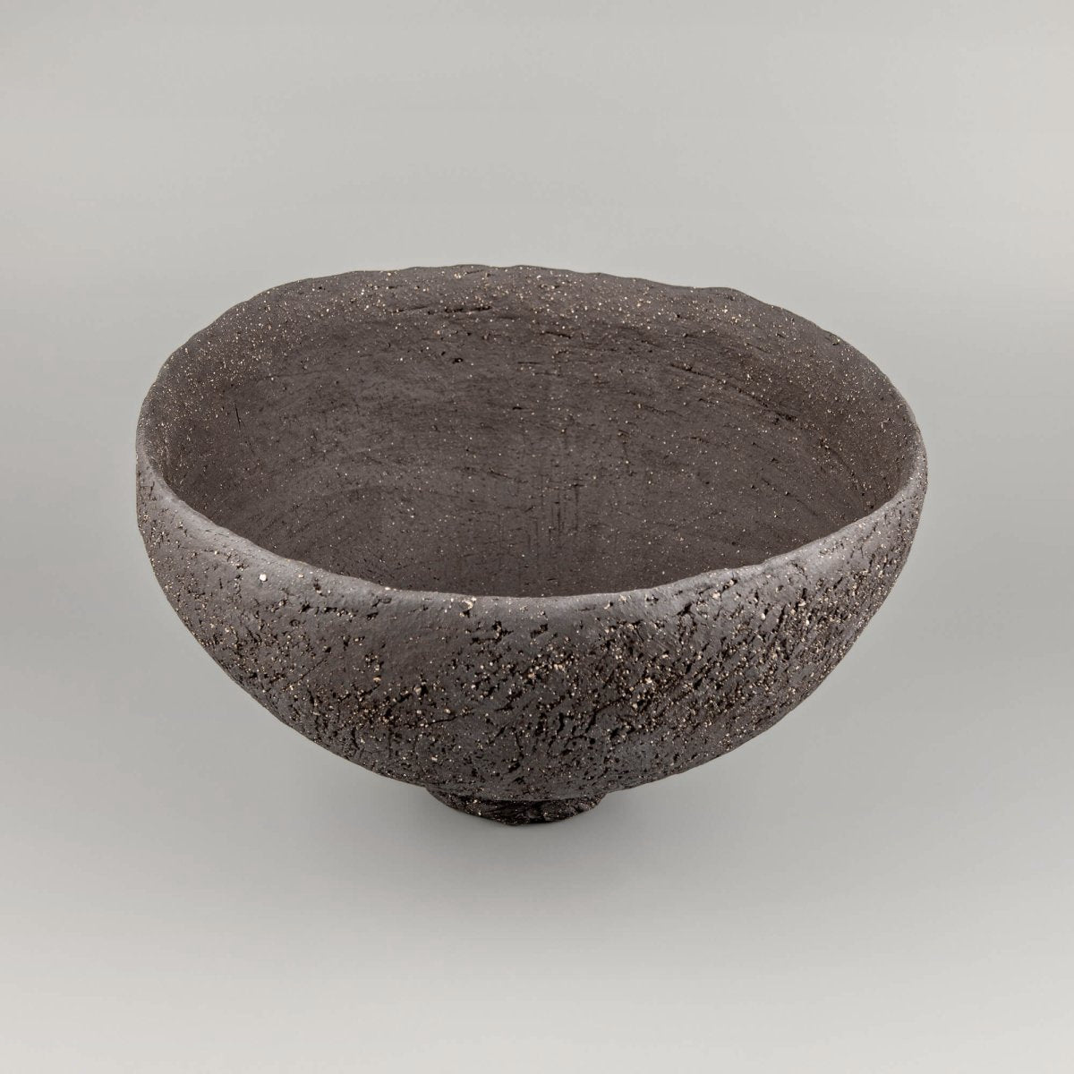 Handcrafted centerpiece side view with deep ceramic form for collectible pottery and fine dining decor.