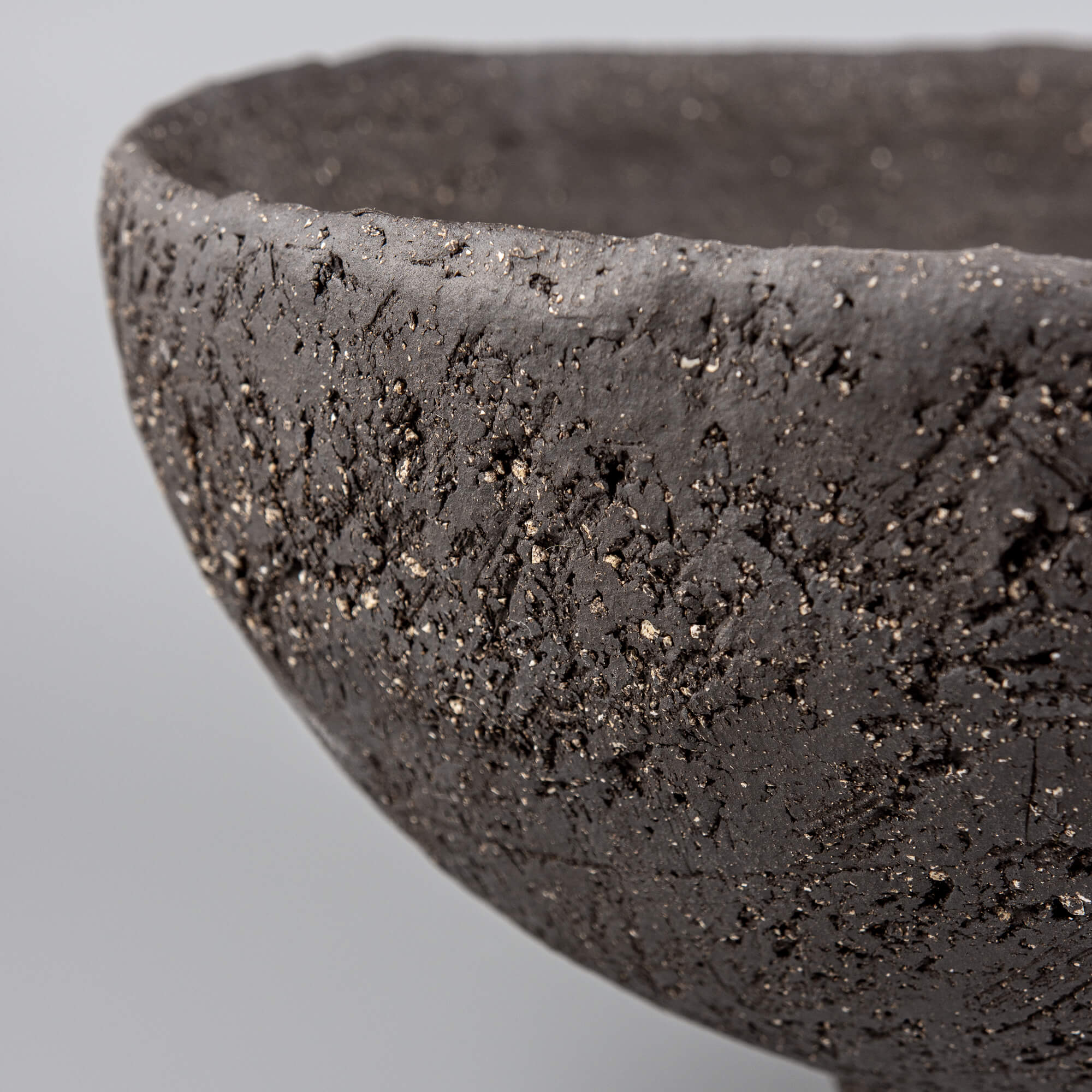 Handcrafted centerpiece front detail with sculptural ceramic foot for fine dining and luxury home decor.