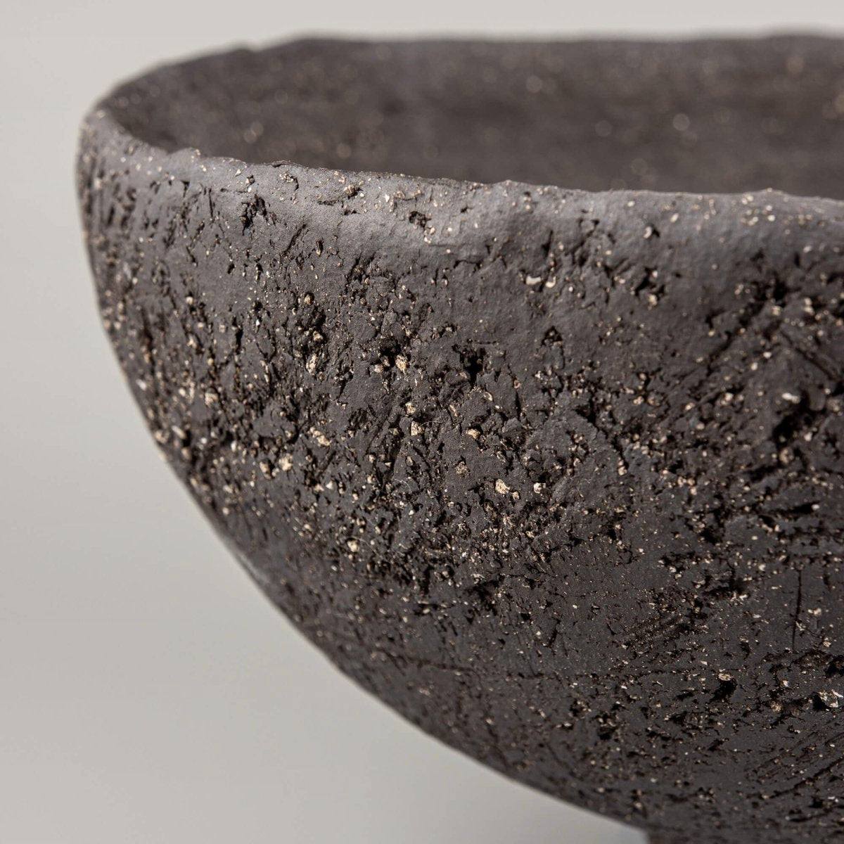 Handcrafted centerpiece front detail with sculptural ceramic foot for fine dining and luxury home decor.
