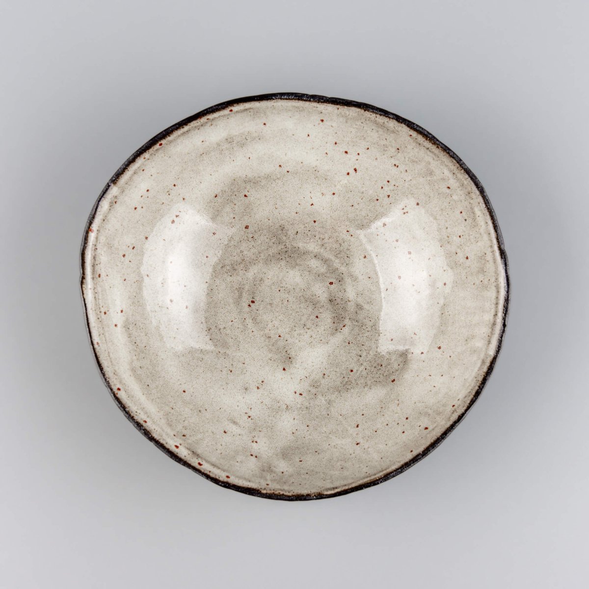 Handmade ceramic bowl side view highlighting sculpted form and precision craftsmanship for premium culinary presentation.