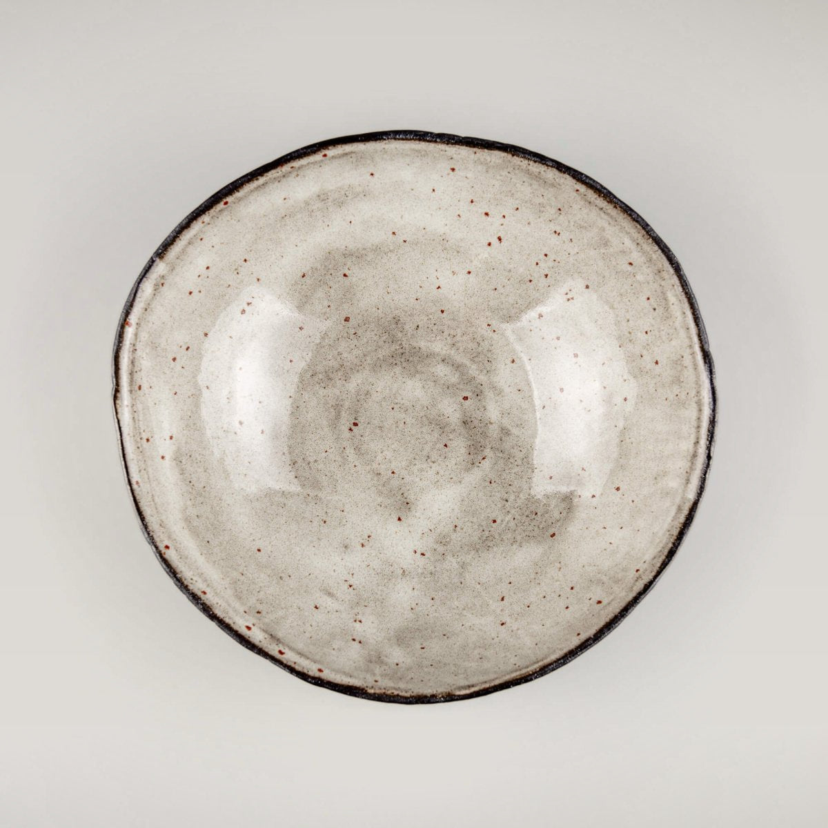 Handmade ceramic bowl side view highlighting sculpted form and precision craftsmanship for premium culinary presentation.