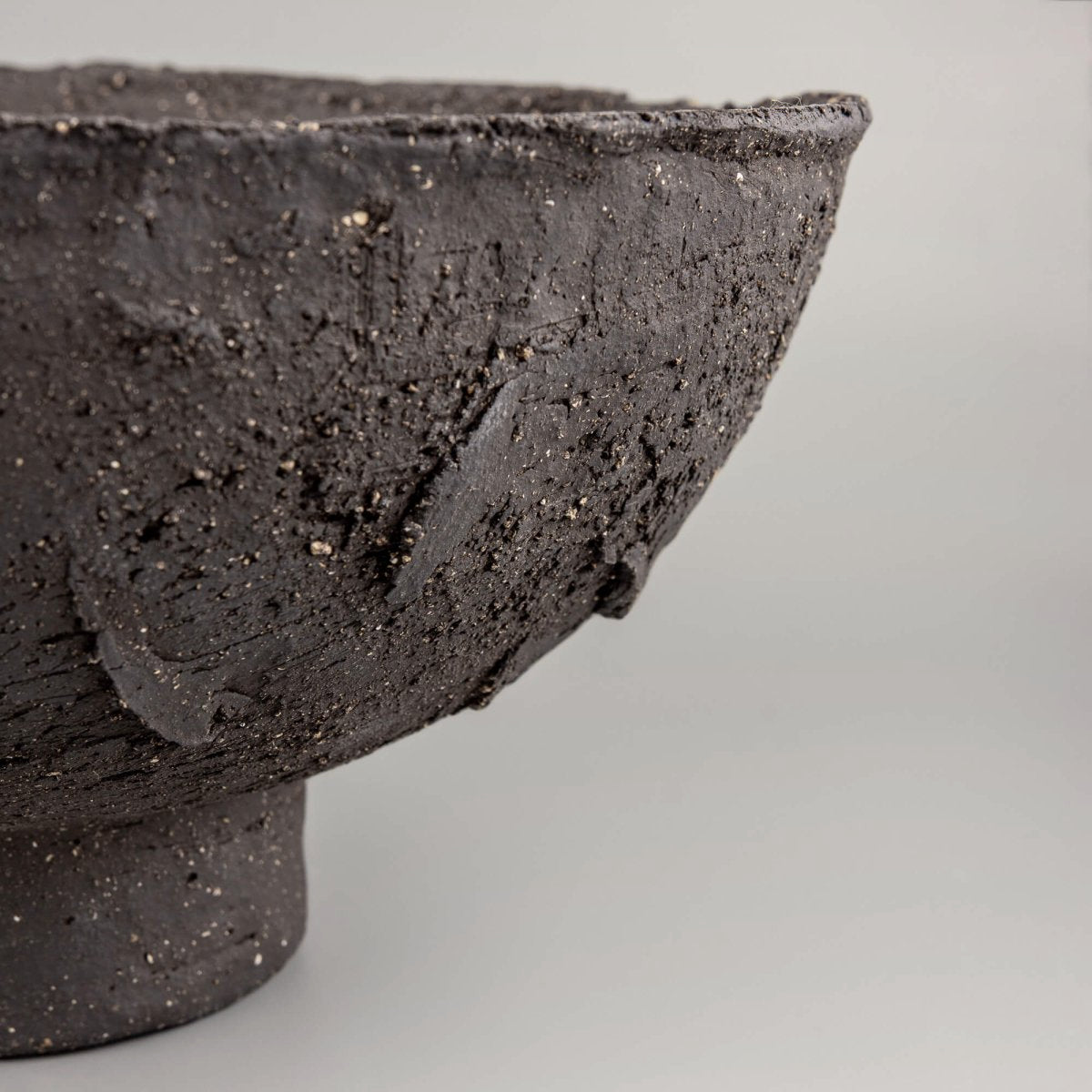 Handmade decorative bowl with dramatic textured exterior, footed base, and fine dining or restaurant centerpiece style.