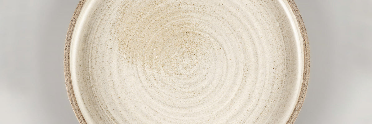 Close-up of handmade ceramic plate in artisanal stoneware, luxury dinnerware crafted for fine dining and master chefs by Stonessa.