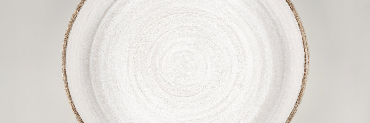 Handmade ceramic platters and luxury stoneware serving trays crafted for fine dining, artistic presentation, and modern interiors by Stonessa.