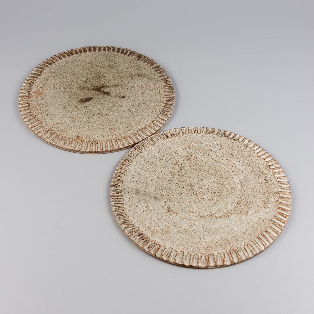 Minimal small ceramic plate for dessert, handmade with artistic flair.