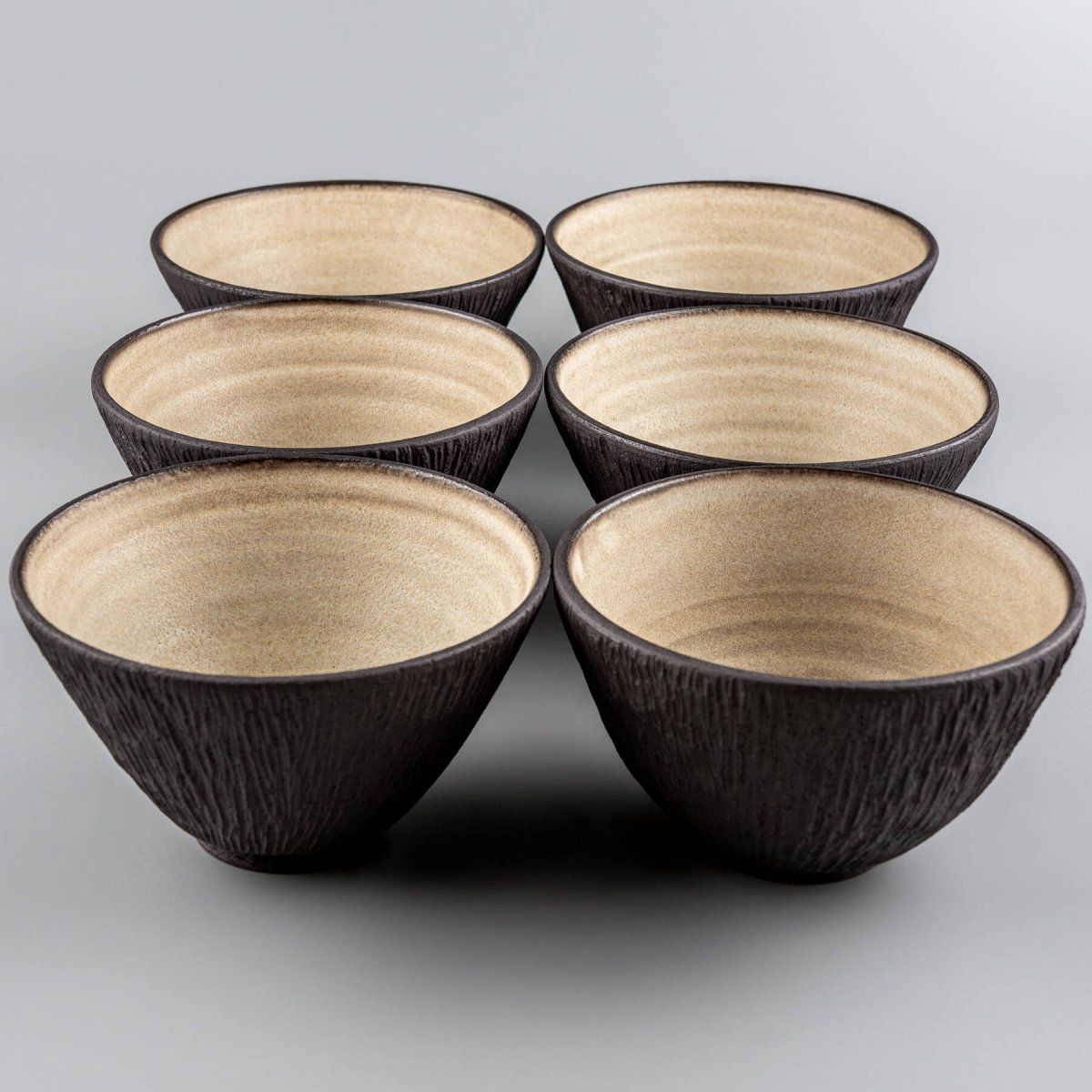 Six premium ceramic bowls displayed as part of a fine tableware collection.