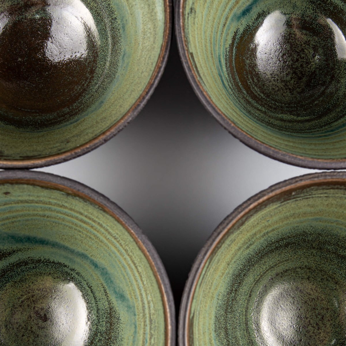 Interior view of artisan pottery bowls used for stylish home dining decor.