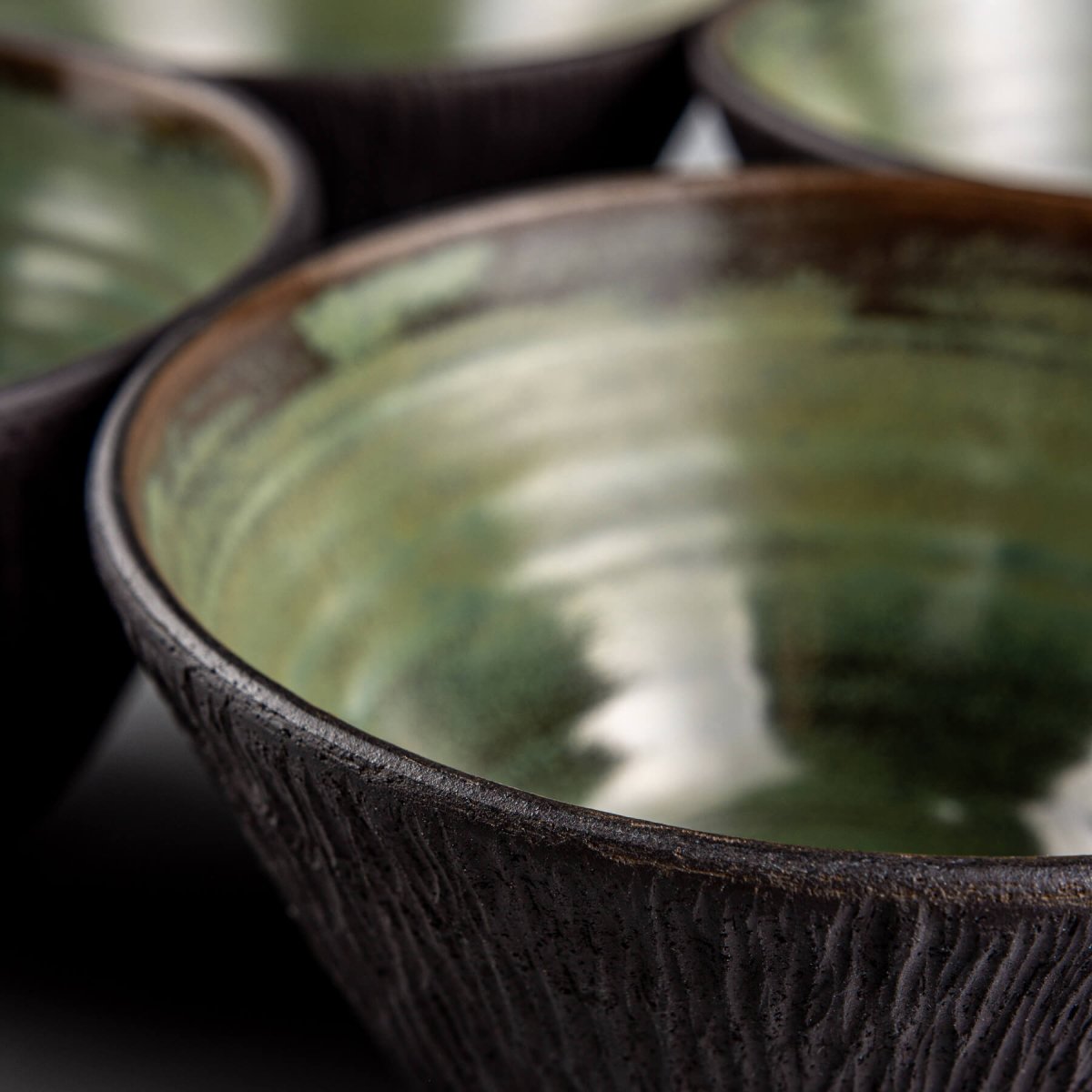 Elegant ceramic bowl set with high-end green glaze ideal for food presentation.