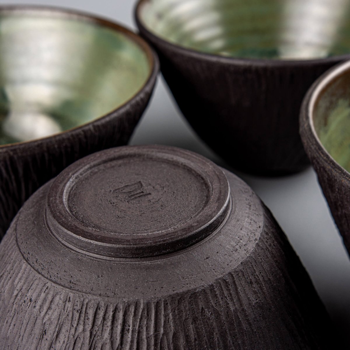 Chef-grade handmade ceramic bowl with smooth glaze and raw textured exterior.