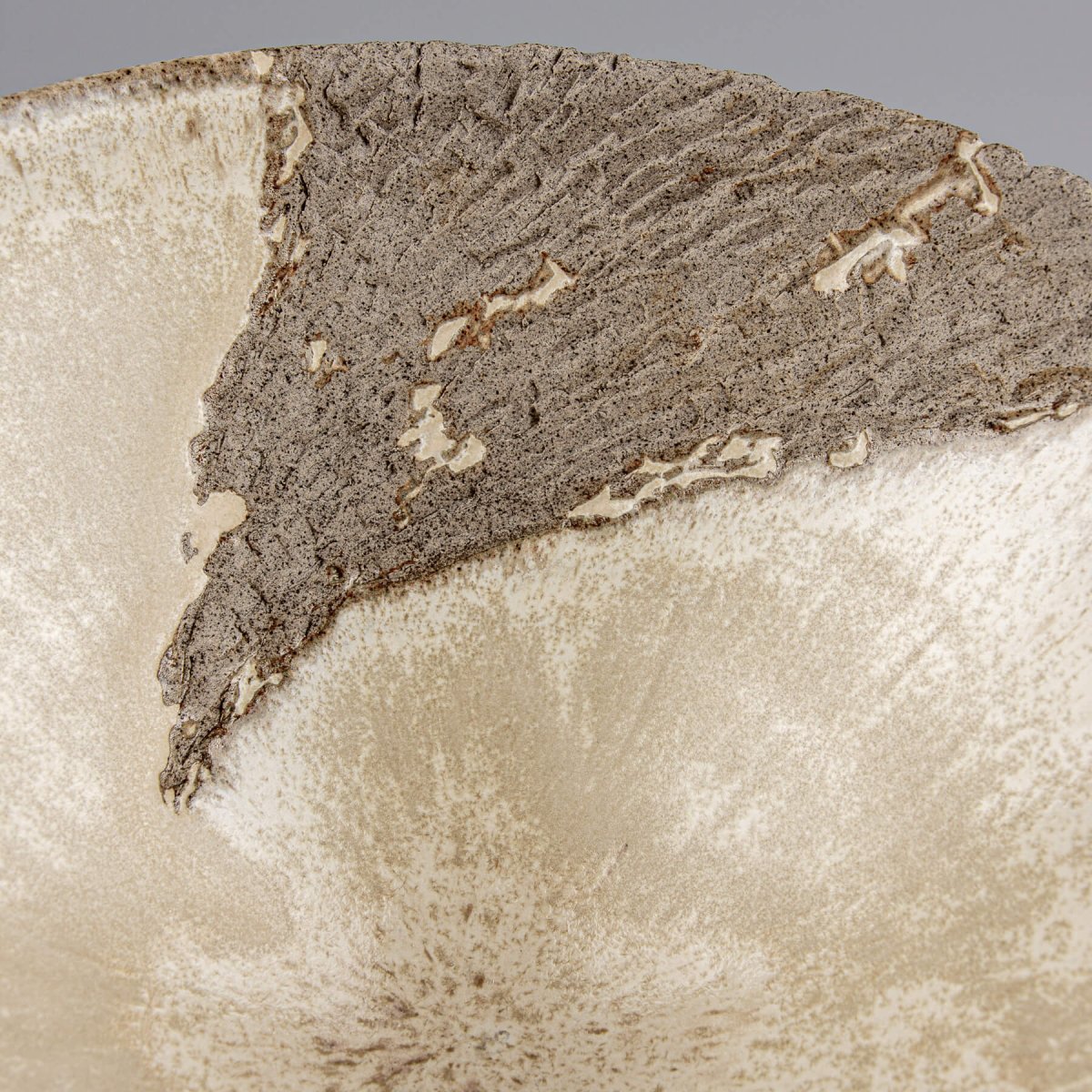 Close-up of bowl texture showing hand-carved detail and organic matte glaze transition.