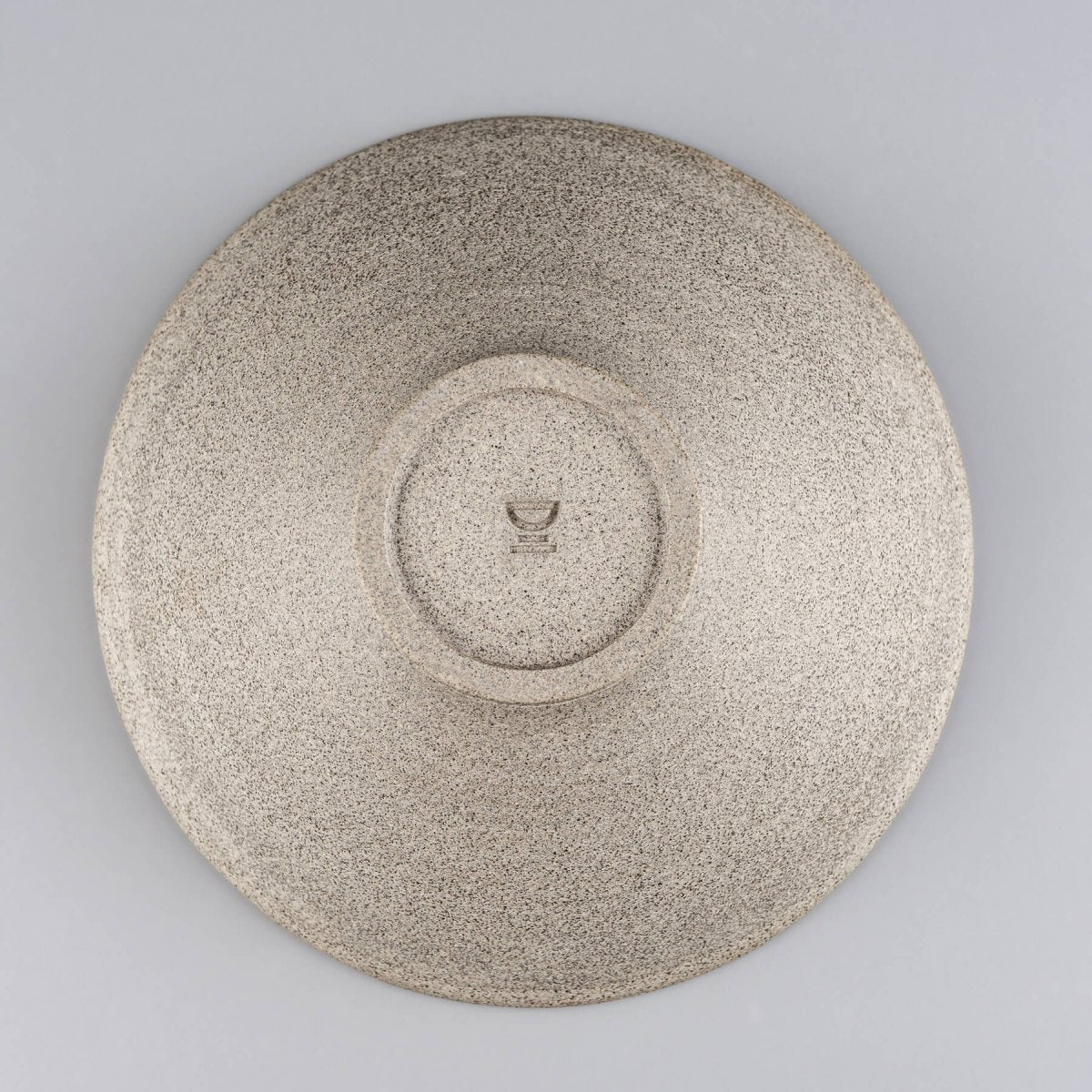 Flat top view of stoneware bowl showing spiral center and balanced proportions.