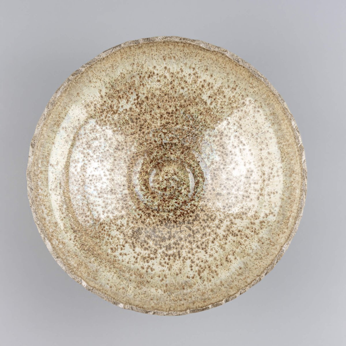 Top view of handmade ceramic bowl with glazed interior and natural clay finish for artisan appeal.