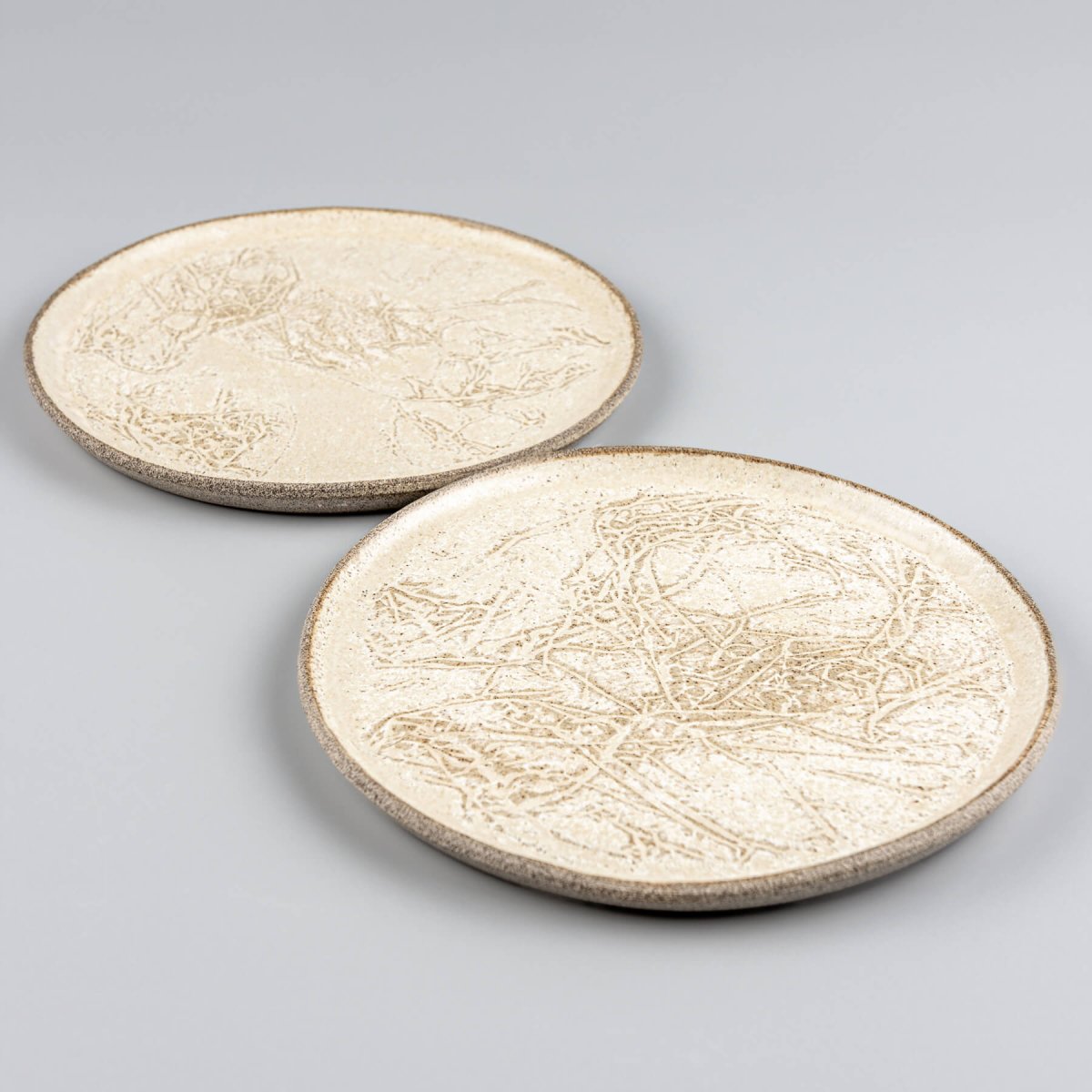 Minimalist plate set designed for dessert or small-course serving.