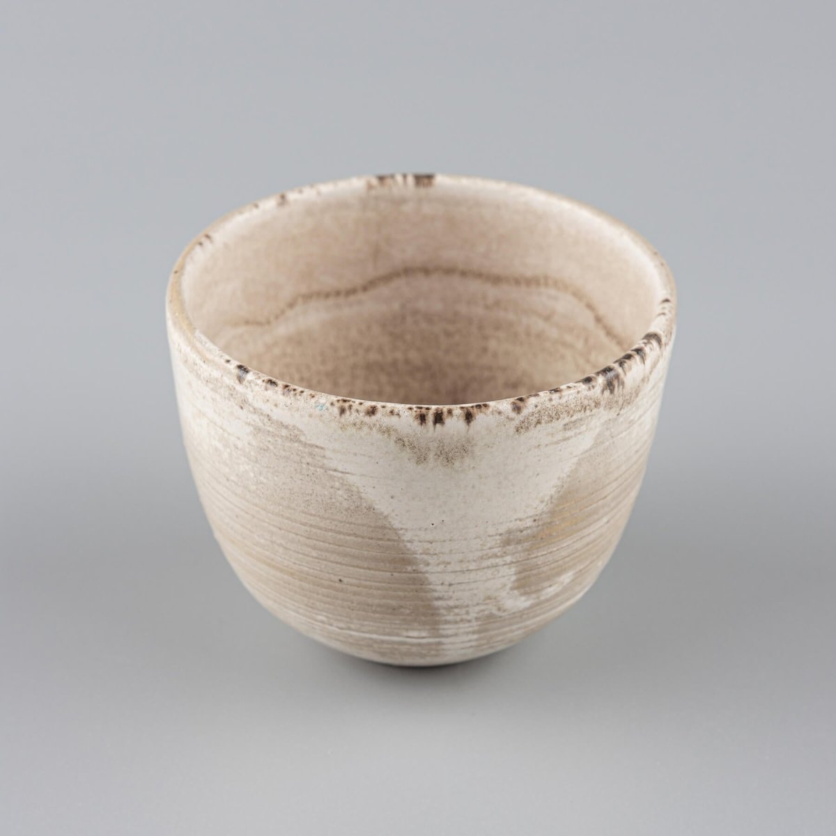 Top view of a handmade stoneware coffee cup with a minimalist design for home and restaurant use.