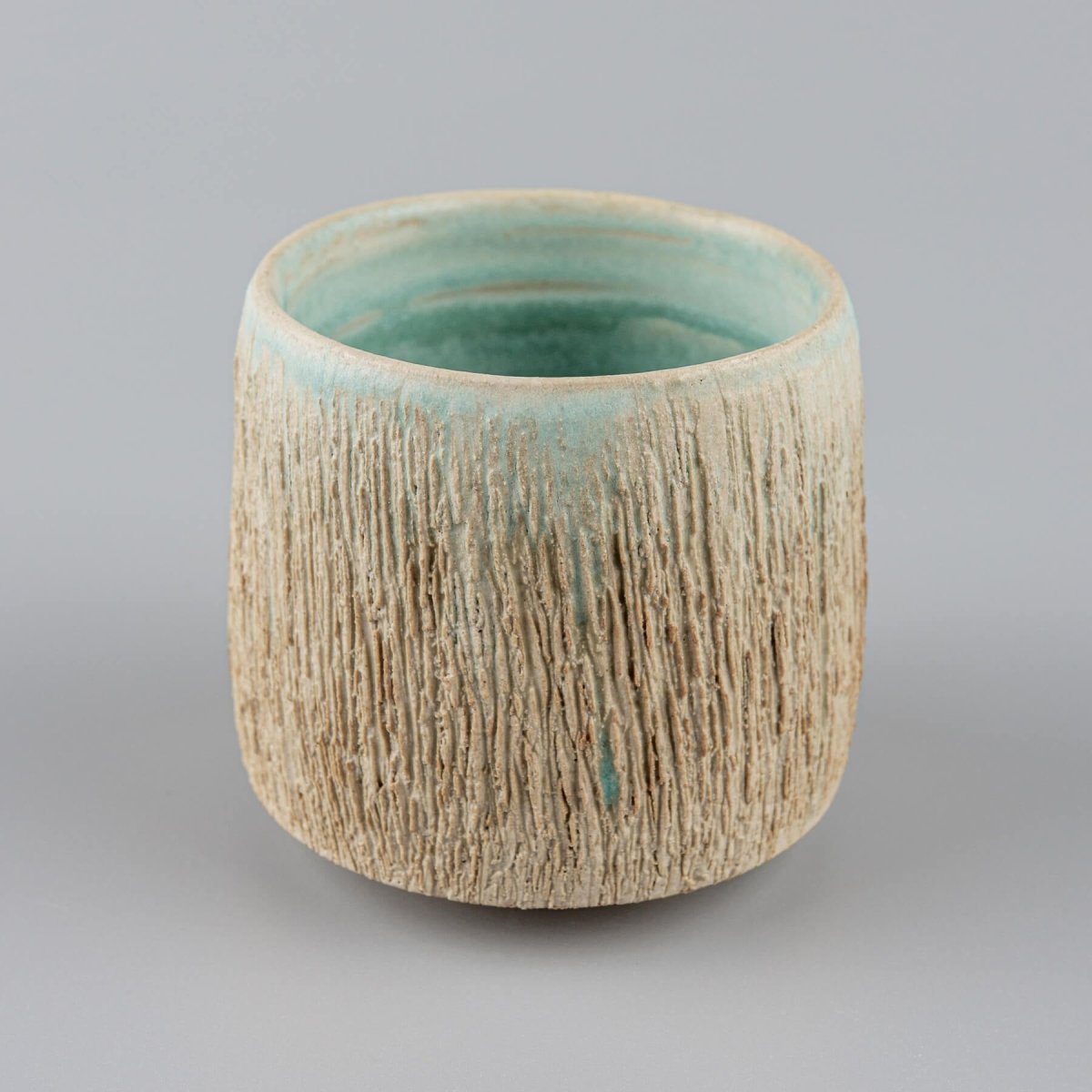 Stoneware pottery mugs with turquoise glaze inside, perfect for coffee, tea, or matcha rituals.