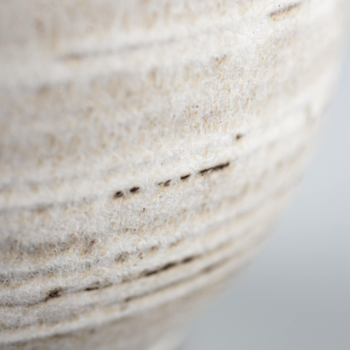 Designer handmade coffee mug with a rustic yet modern look, created as a collectible pottery piece.