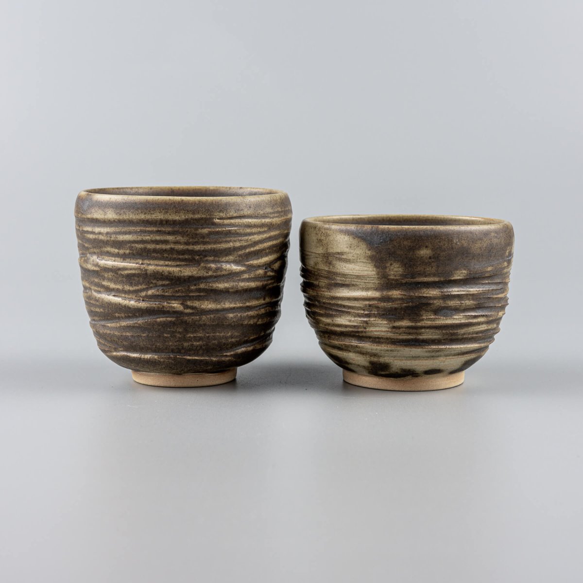 Handmade ceramic mug with earthy olive glaze and textured exterior, perfect for home, hotel, or as a wedding gift.