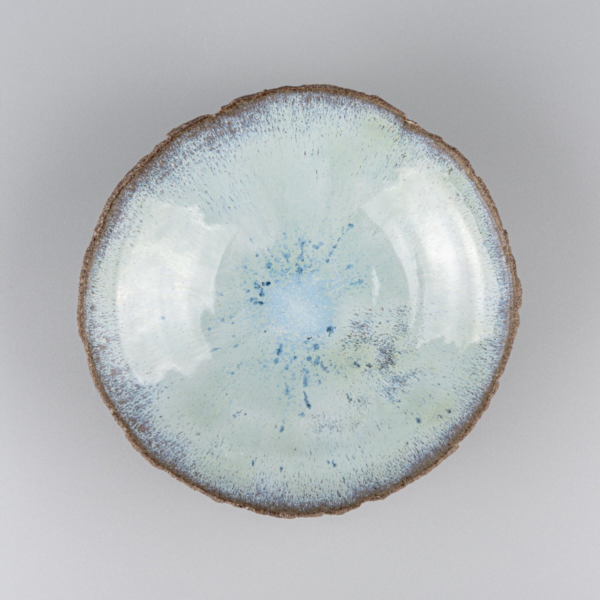 Top view of artisan ceramic bowl showing ocean-inspired blue glaze.