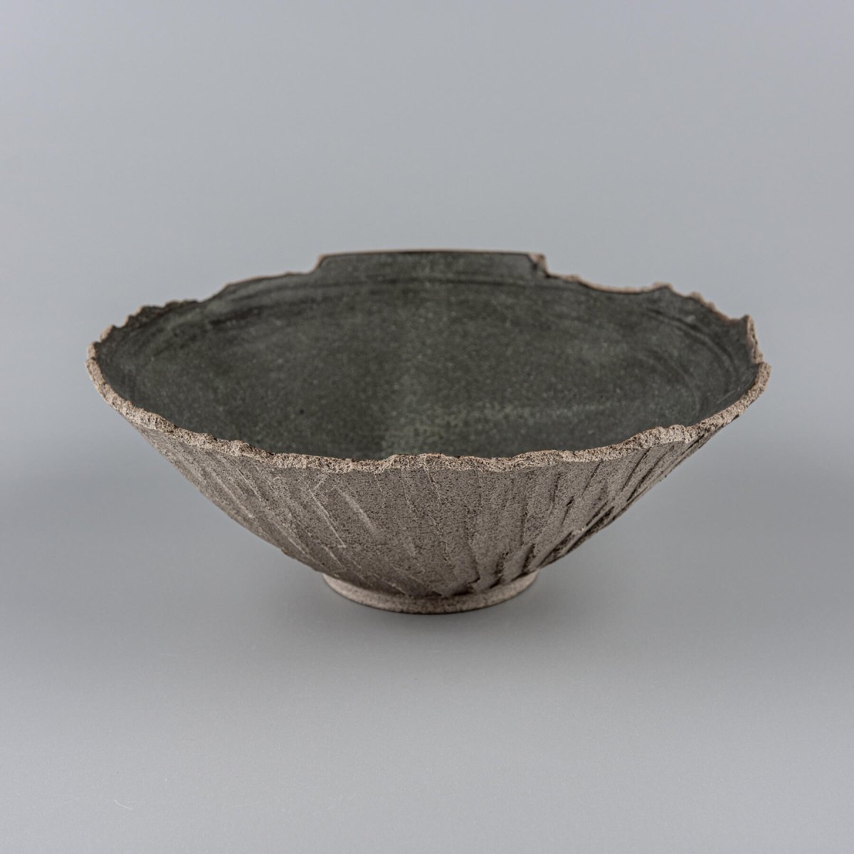 Interior detail of matte black glazed ceramic bowl, made for culinary presentation and decor.