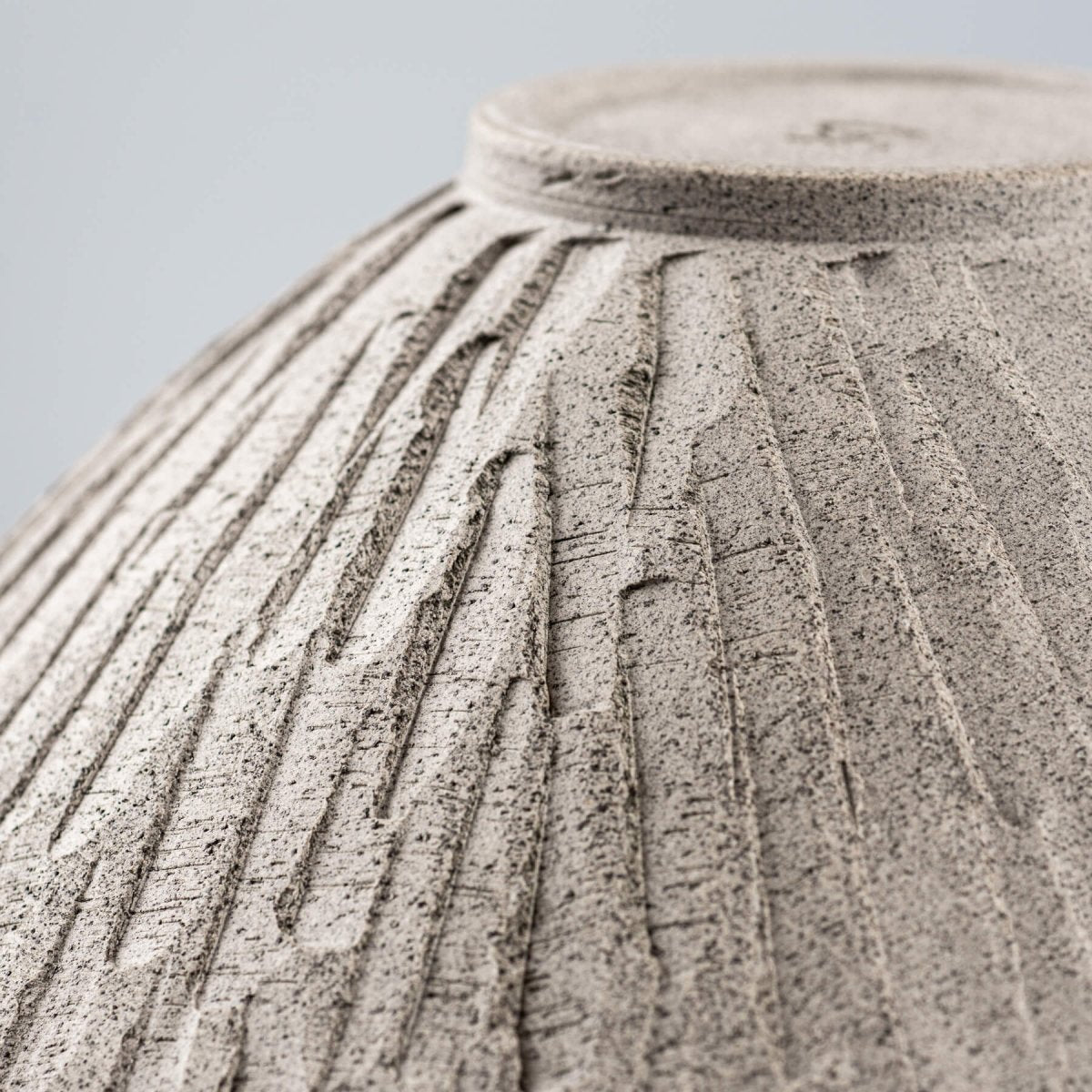 Underside texture of ceramic bowl with visible turning marks, great for display or functional kitchenware.