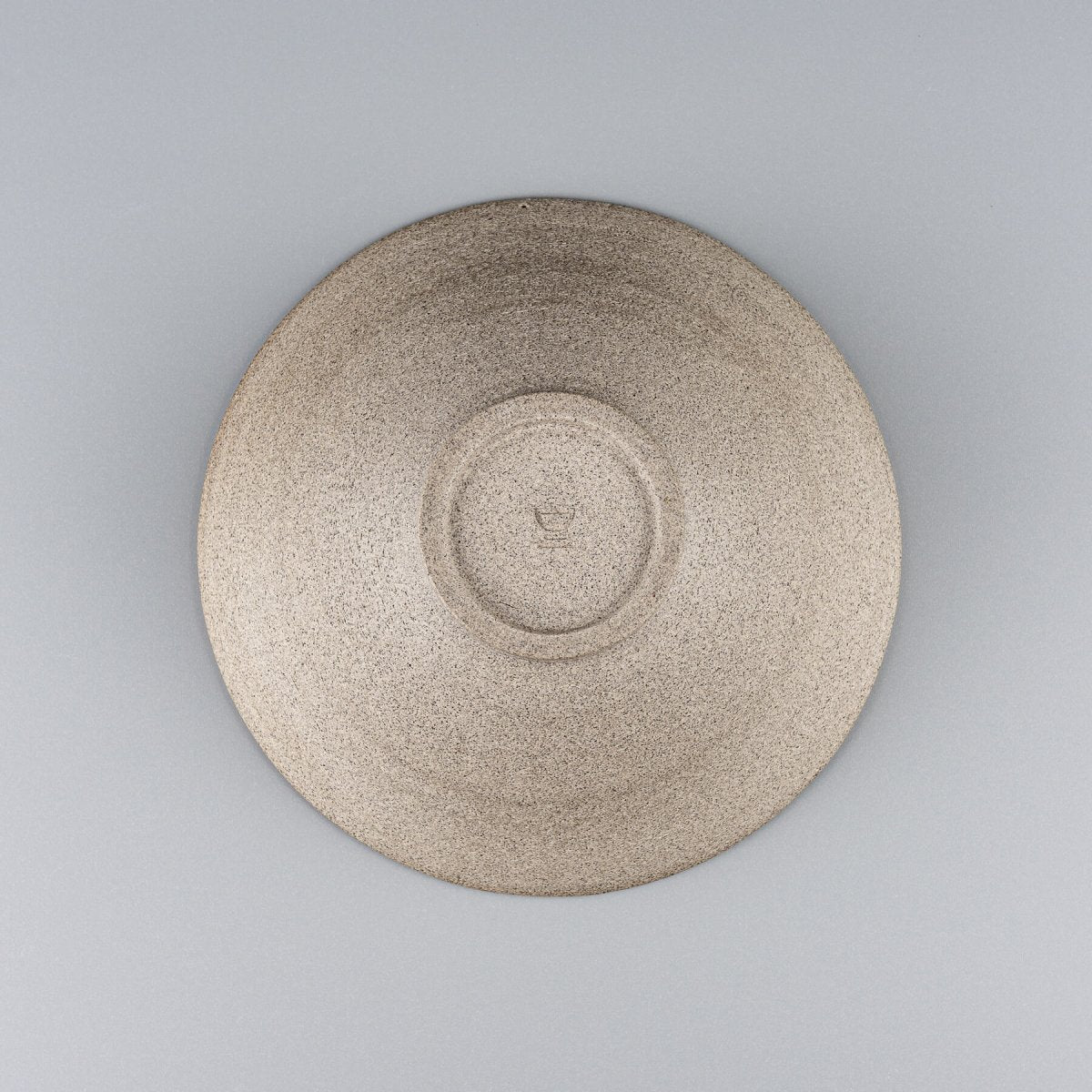 Bottom view of handmade bowl, perfect for collectible pottery collections.