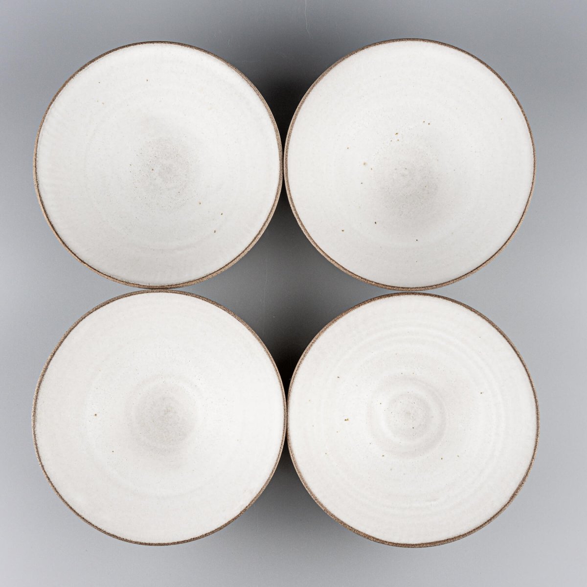 Set of stoneware bowls arranged for restaurant or boutique hotel presentation.