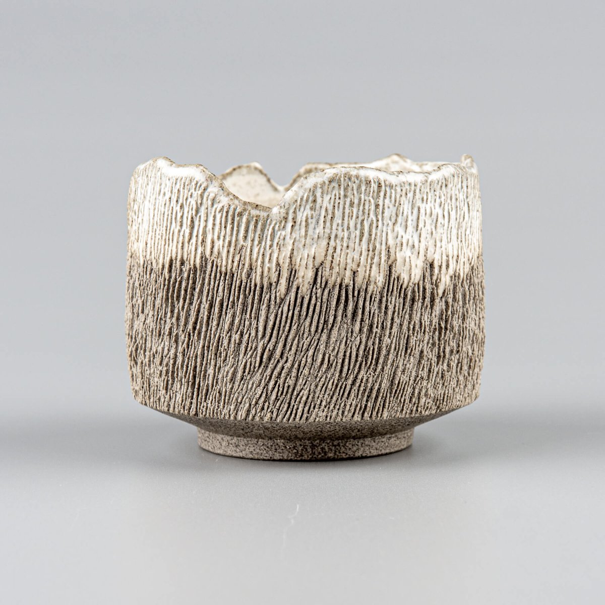 Handcrafted coffee cups, stoneware with carved texture and semi-gloss glaze for home and fine dining.