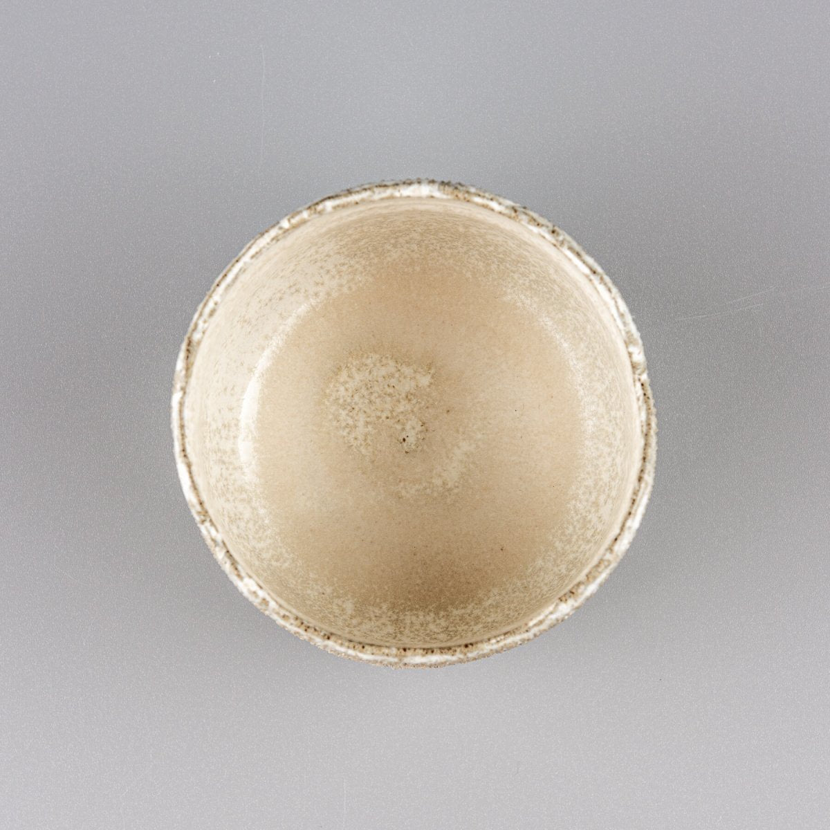 Interior view of handmade stoneware coffee cups with semi-gloss white glaze.
