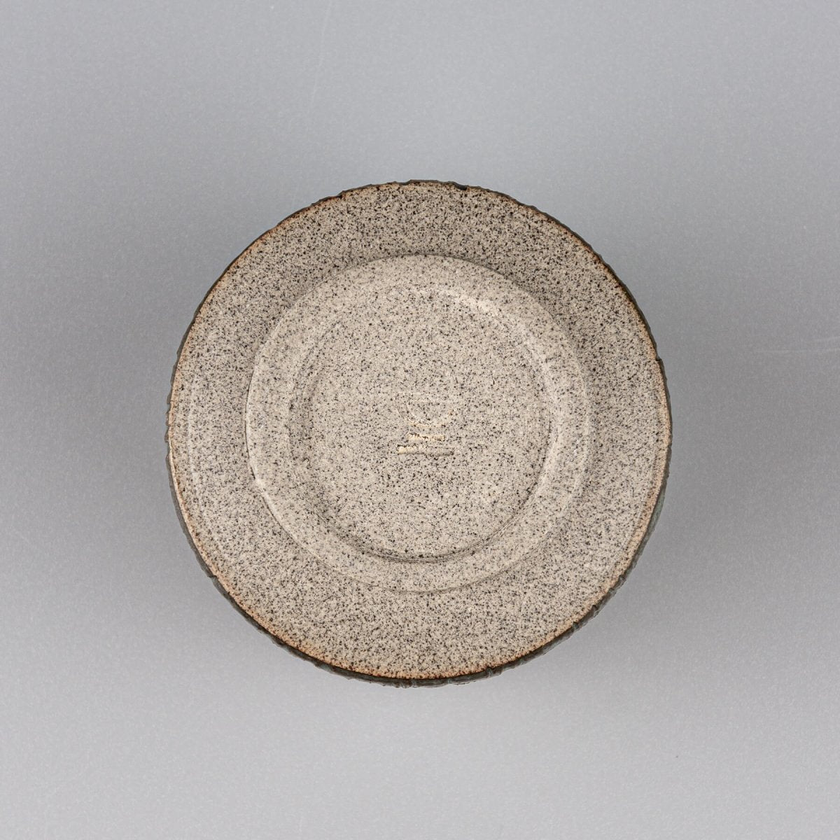 ChatGPT said:

Handcrafted stoneware coffee cups base with circular carved texture, ceramic detail for collectible pottery.