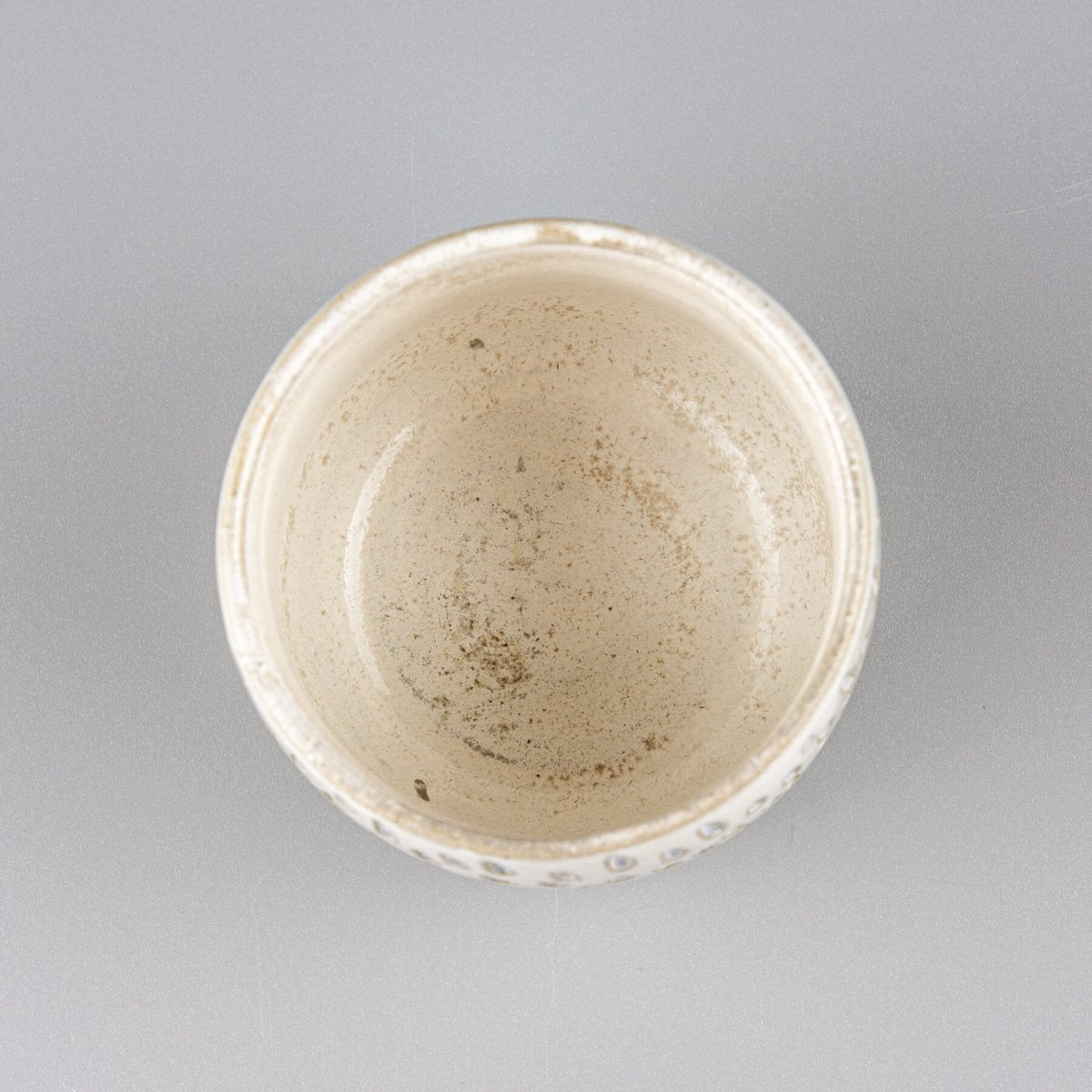 Top view of ceramic espresso cup with handmade droplet design, ideal for collectible kitchenware.