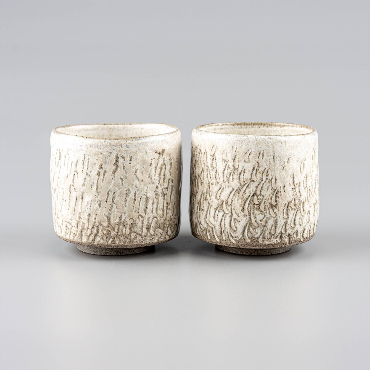 Rustic ceramic espresso cups, handmade with a textured design for home, fine dining, and boutique hotels.