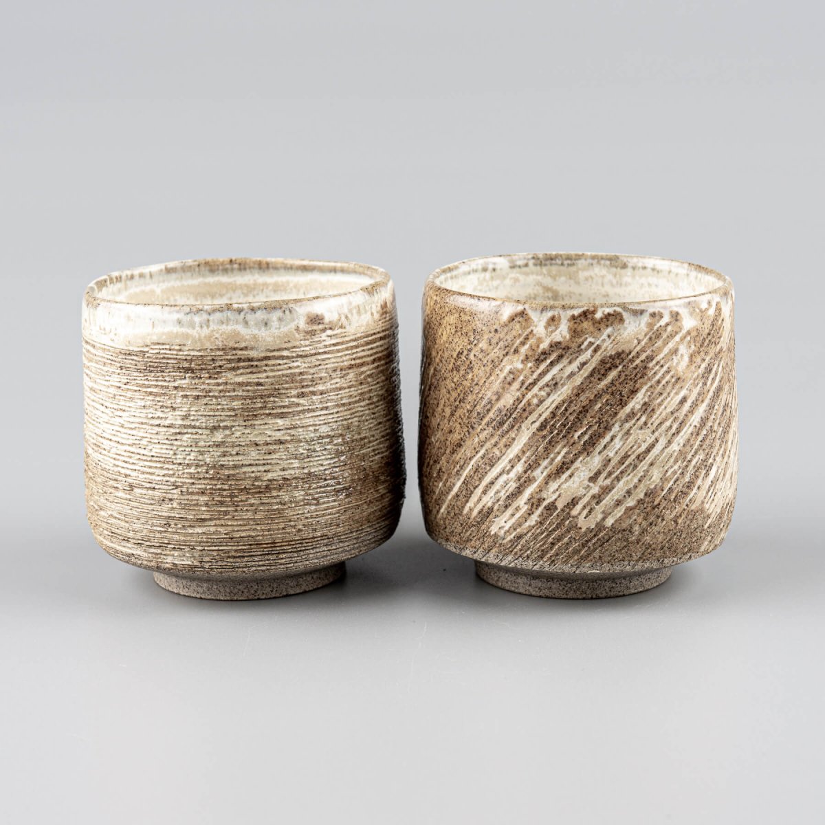 Handmade ceramic mugs set with earthy matte finish, ideal for fine dining and boutique hotels.
