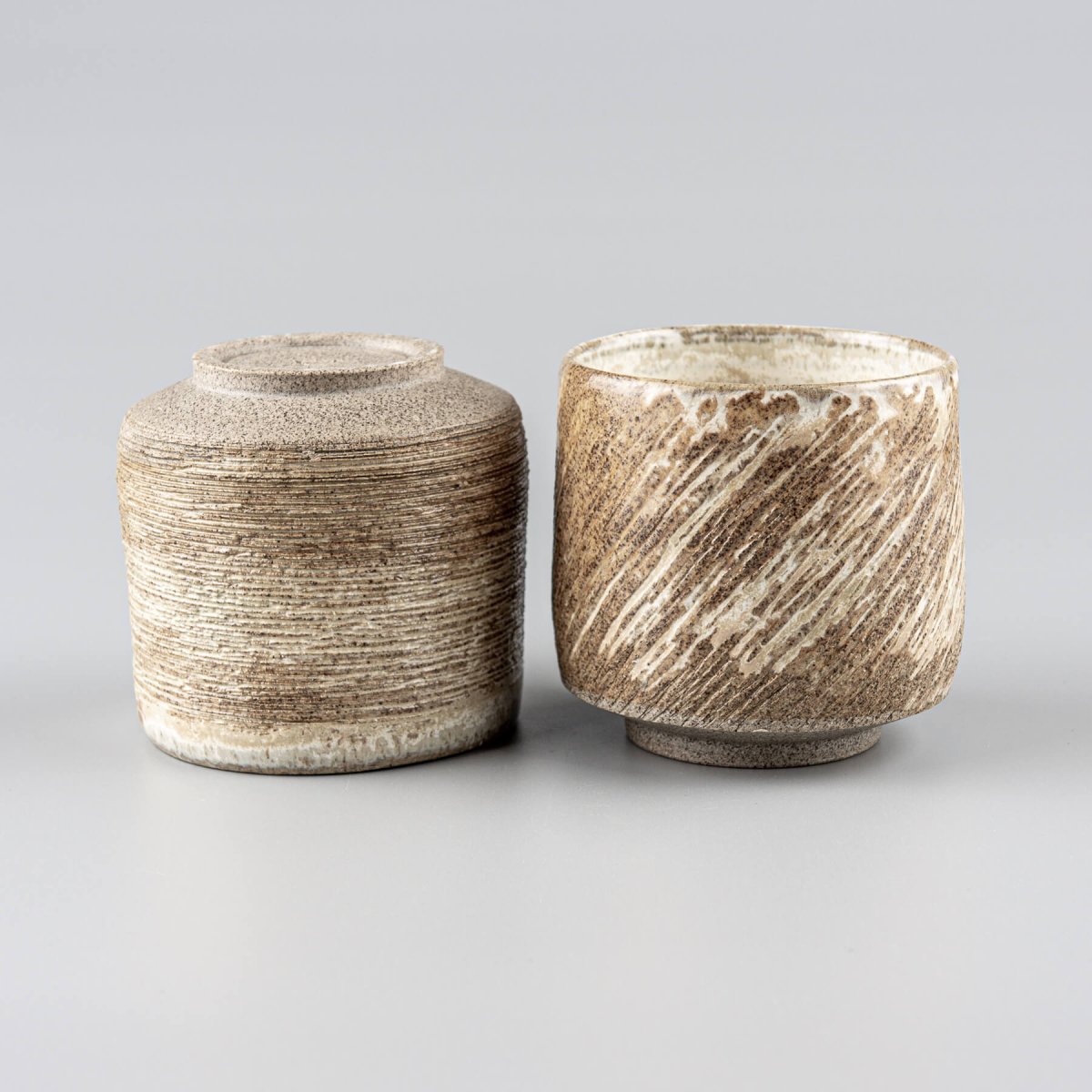 Artisan ceramic mugs with earthy texture, handmade décor and kitchenware for interior design lovers.