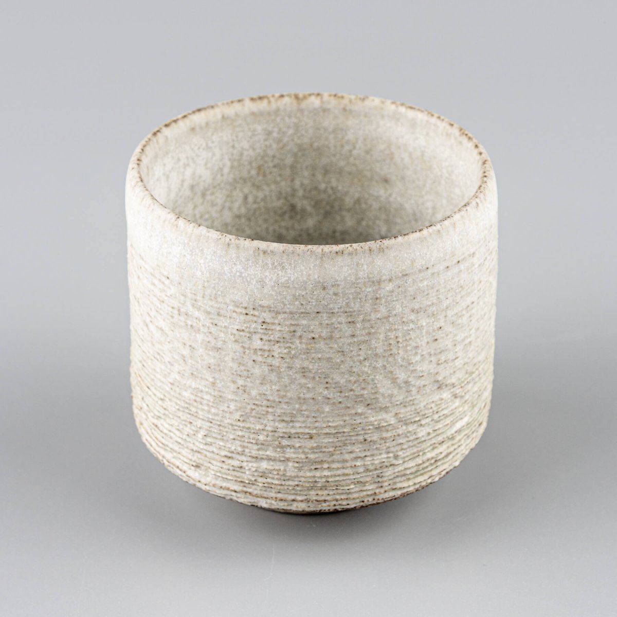 Pair of pottery mugs with textured glaze, perfect as a wedding or housewarming gift.