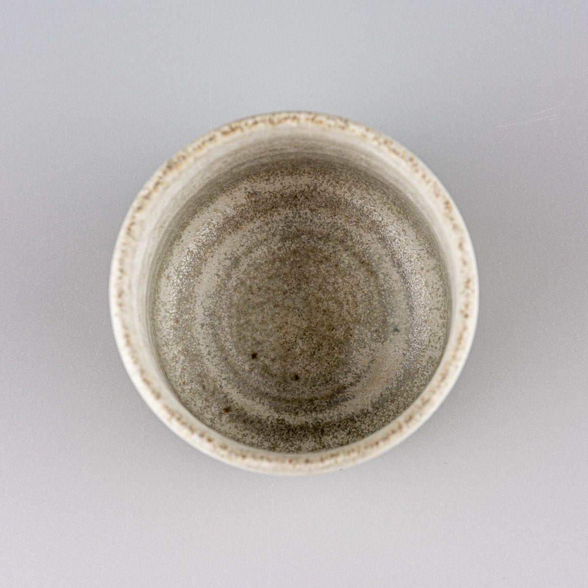 Close-up of handmade ceramic surface, showcasing collectible pottery craftsmanship.