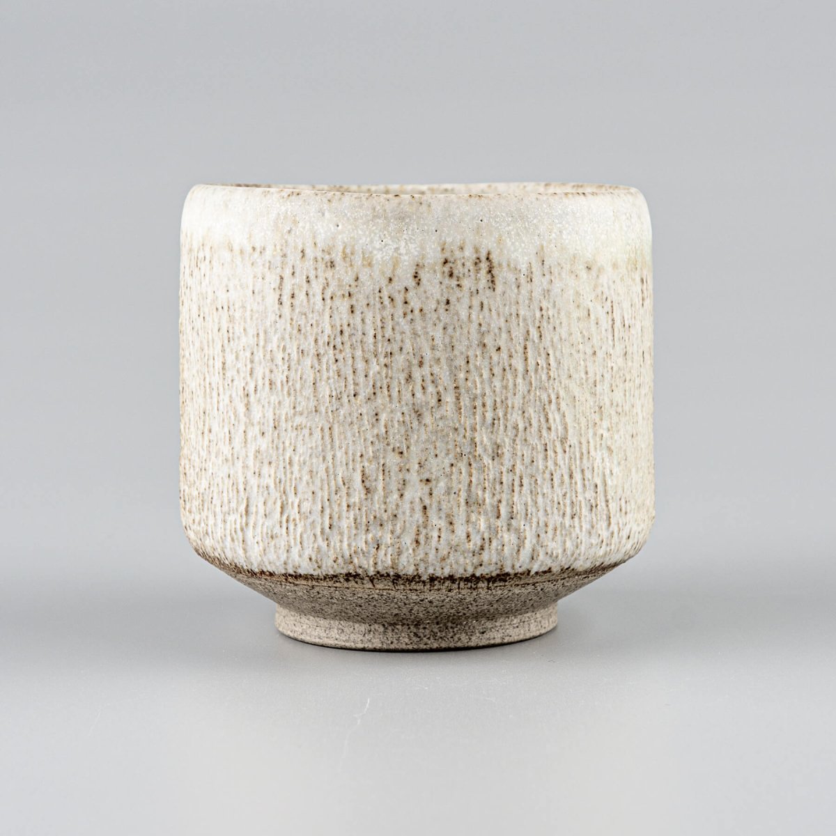 Top view of artisan ceramic mugs for tea, coffee, and matcha tea rituals.