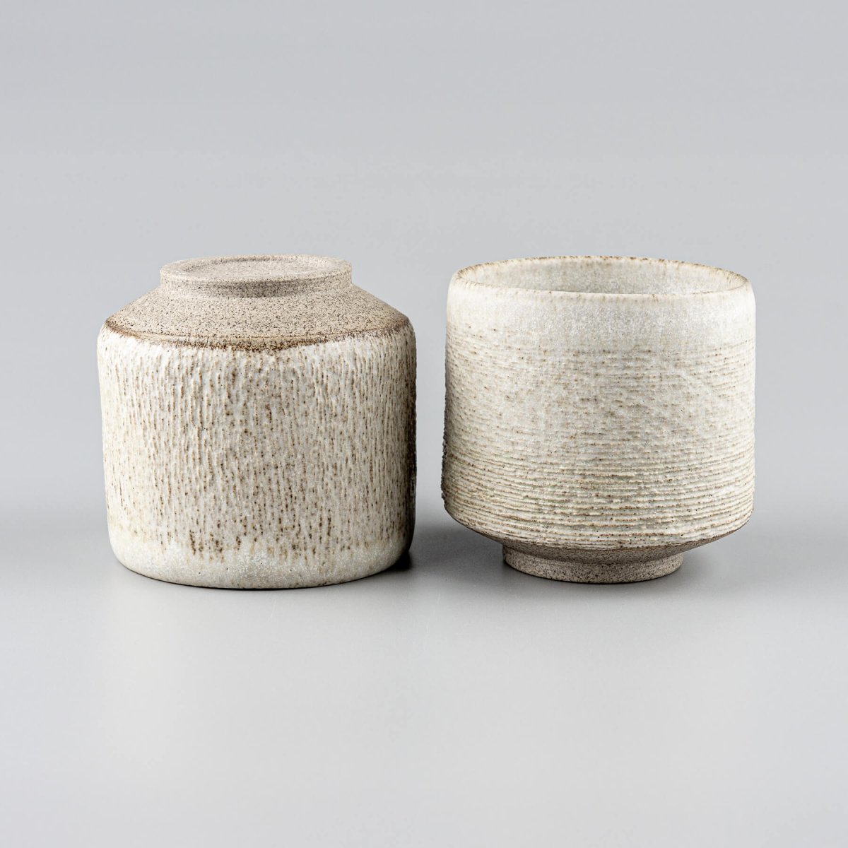 Fine carving on ceramic mugs, perfect for private collectors and home decor.